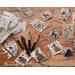 Several woodland animal tags are laid out on a trunk. Wood-burning pens are next to the gift tags. A natural cord is tied to each tag. 